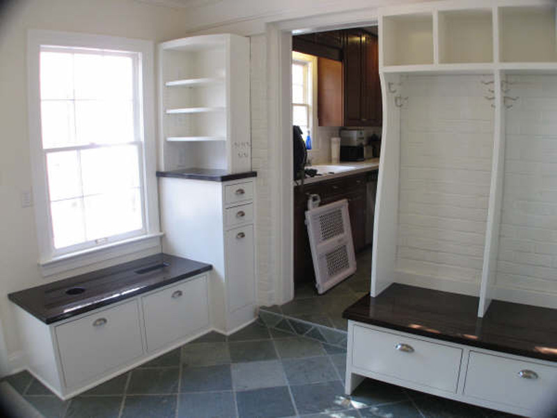 Mudroom with cubbies, garbage and recycling drawers. Countertops are stained maple. Finishing by Jenny Wuest.