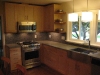 Kitchen cabinets with concrete countertops.