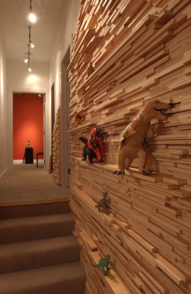 Wall skinned in strips of birch plywood.