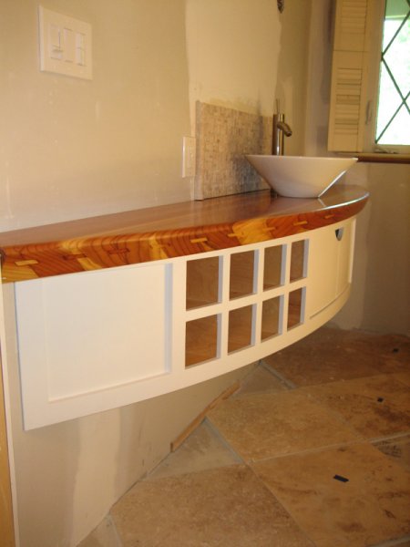 Curved vanity with solid redwood top.